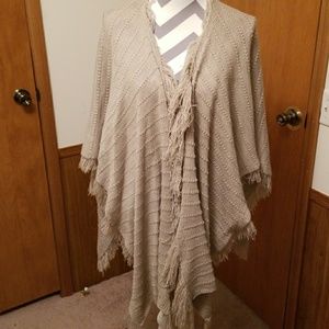 Cute comfy shaw greyish tan in color.